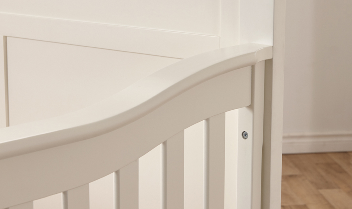 A detail of the Napoli Forever Crib with Flat-Top Headboard, in White.